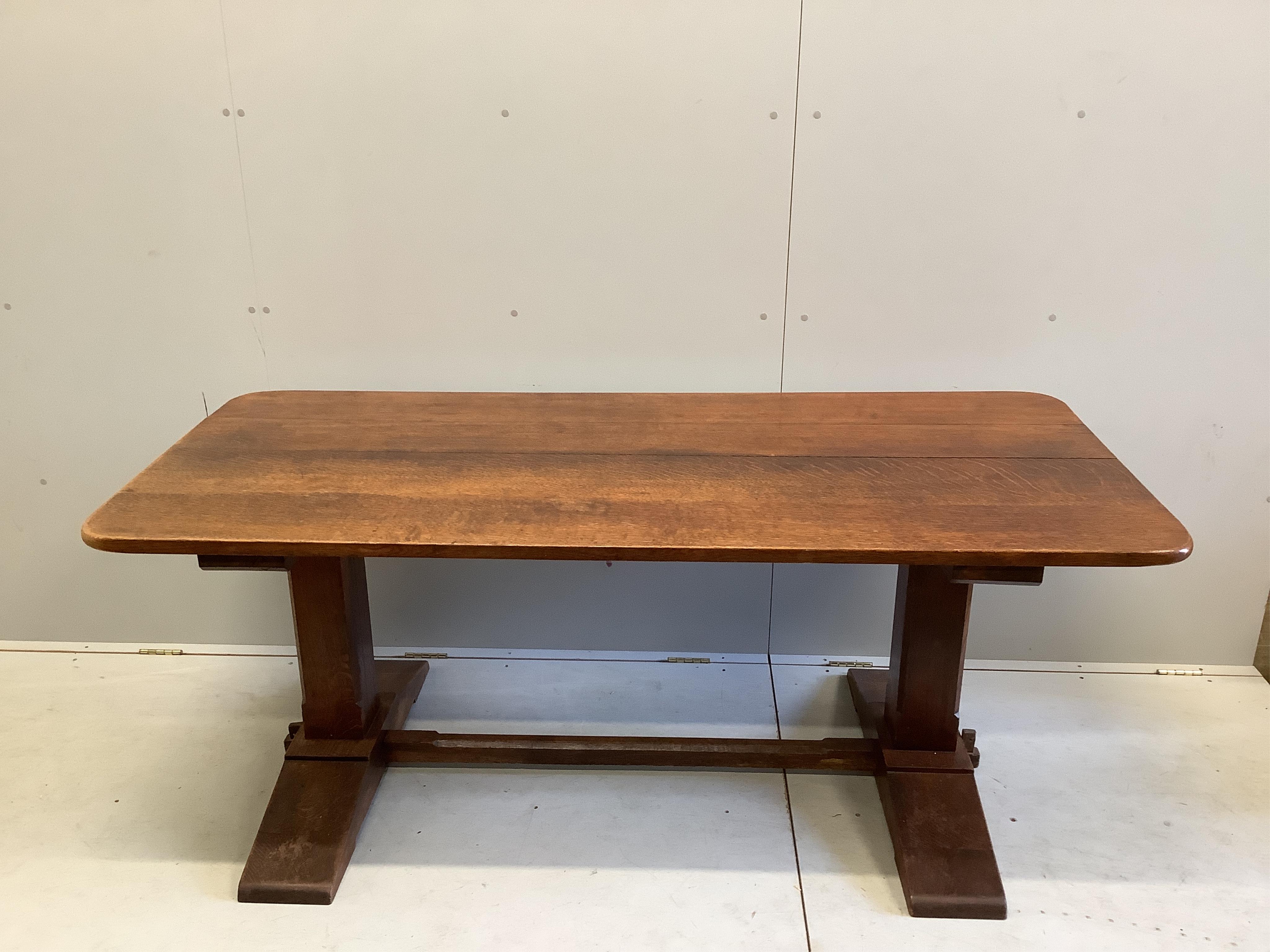 A 18th century style rectangular oak refectory dining table, width 183cm, depth 82cm, height 74cm and six rush seat ladderback chairs
